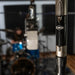 Neutrik Cloud microphone in a music studio with a drummer in the background