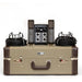 Vintage-style audio equipment set including microphones, cables, and a console on a beige suitcase.
